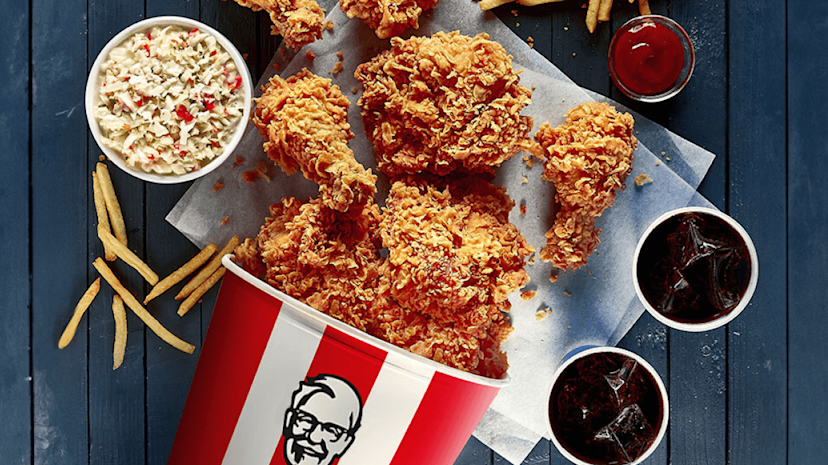A selection of KFC products on a table viewed from above.