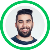 Headshot portrait of a smiling person with dark beard against green circular background