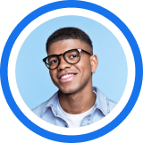 A smiling person wearing glasses and a light blue button-down shirt against a bright blue circular background